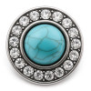 SnapAccents round snap jewelry charm featuring a central turquoise stone with natural veining, surrounded by a circle of clear sparkling rhinestones set in antique silver-tone metal, perfect for interchangeable snap bracelets, necklaces, and accessories.