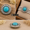 snap jewelry charm with a round turquoise center stone surrounded by a circle of clear rhinestones in a silver-tone setting, shown loose and attached to a beige braided bracelet