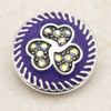 18MM purple snap jewelry charm with three interlocking hearts decorated with sparkling rhinestones and a silver swirl border
