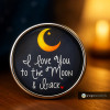 SnapAccents snap jewelry charm with "I love you to the Moon & back" text, featuring a yellow crescent moon and star design on a black background, perfect for personalized snap bracelets, necklaces, and gifts.
