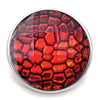 Red and black textured snap jewelry charm with glossy finish, round metal base, vibrant reptile skin pattern, interchangeable accessory for SnapAccents snap jewelry collection, stylish and bold fashion statement piece.