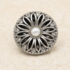 round silver snap jewelry charm with a daisy flower design featuring a white pearl center and clear rhinestones around the petals