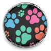 SnapAccents snap jewelry charm with colorful paw prints in blue, pink, green, and orange on a black background, interchangeable accessory for snap bracelets and necklaces.