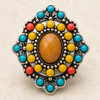 Antique bead snap jewelry charm with a faceted brown oval center surrounded by yellow, aqua, and coral round beads in a silver ornate setting