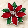 Poinsettia flower snap jewelry charm with red and green enamel petals outlined in silver tone and silver bead accents in the center