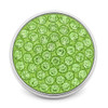 round snap jewelry charm covered in lime green rhinestones with a silver metal edge