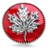 Red SnapAccents snap jewelry button featuring a detailed silver maple leaf design, perfect for fall and Canadian-themed accessories, displayed on a cozy plaid fabric background.