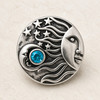 round silver snap jewelry charm featuring a sun with an engraved face, crescent moon, stars, and a central blue rhinestone