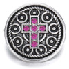 Round silver snap charm with intricate circular patterns and a central cross adorned with seven bright pink rhinestones, designed for SnapAccents snap jewelry collections.