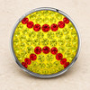 round snap jewelry charm with yellow rhinestones and red rhinestone stitching pattern resembling a softball, silver metal edge engraved with SNAP ACCENTS