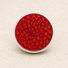 round snap jewelry charm with multiple red rhinestones set in a silver-tone base