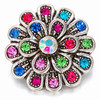 multi-color rhinestone flower snap jewelry charm with blue, pink, green, and red stones surrounding a central iridescent stone in a silver-tone setting