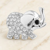 silver snap jewelry charm shaped like an elephant with clear rhinestones on the body and a black gem eye