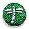 green snap jewelry charm with silver dragonfly over textured chevron background