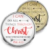 SnapAccents snap jewelry featuring inspirational Bible verse "I can do all things through Christ who strengthens me" Phil. 4:13, two interchangeable snap charms with white and gold backgrounds, displayed with a silver cross necklace on a tan surface.