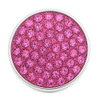 round snap jewelry charm covered with multiple bright pink rhinestones set in a silver-tone base