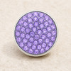 round snap jewelry charm covered with multiple faceted lilac purple rhinestones set in a silver-tone metal base