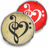 SnapAccents snap jewelry buttons featuring a black treble and bass clef heart design on vintage beige background and a white treble and bass clef heart design on vibrant red background, perfect for music lovers, interchangeable snap charm accessories, stylish and unique gift idea.