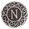 Silver-tone SnapAccents snap charm with intricate filigree design and raised letter "N" in the center, textured background, decorative round interchangeable jewelry accessory.