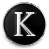 Black SnapAccents snap jewelry charm with silver letter K initial, round metal interchangeable accessory for bracelets and necklaces, personalized fashion statement piece.