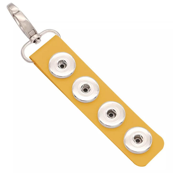 Yellow leather SnapAccents snap jewelry keychain with four silver snap button bases and a silver lobster clasp for interchangeable snap charms accessory.