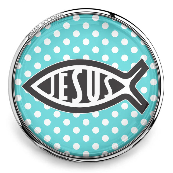 Round SnapAccents snap jewelry charm with turquoise background and white polka dots, featuring a black Christian fish symbol with the word "JESUS" inside, silver metal frame.