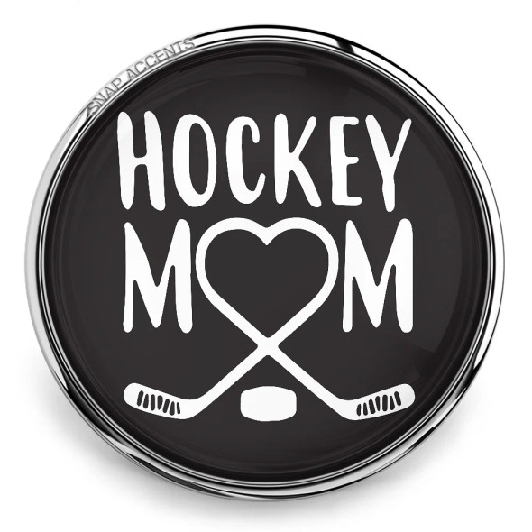 SnapAccents snap jewelry charm with black background, white "Hockey Mom" text, heart-shaped design formed by crossed hockey sticks and puck, perfect gift for hockey moms, sports accessory, interchangeable snap button jewelry.