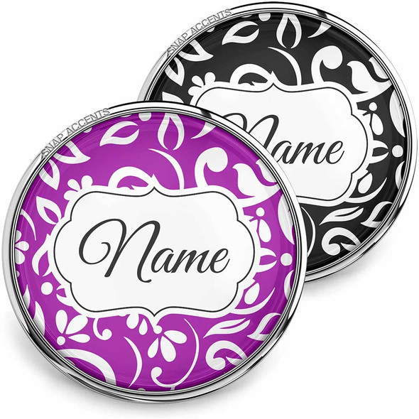 SnapAccents customizable snap jewelry buttons with elegant floral swirl design in purple and black, featuring a central white label area for personalized name engraving, perfect for unique fashion accessories and gift ideas.