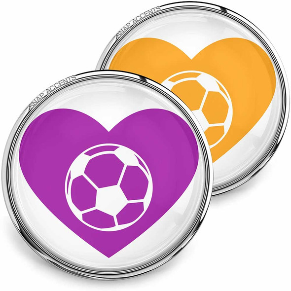 SnapAccents snap jewelry buttons featuring colorful heart designs with white soccer ball icons, interchangeable decorative accessories for bracelets, necklaces, and charms, available in vibrant purple and orange, perfect for soccer fans and sports lovers.