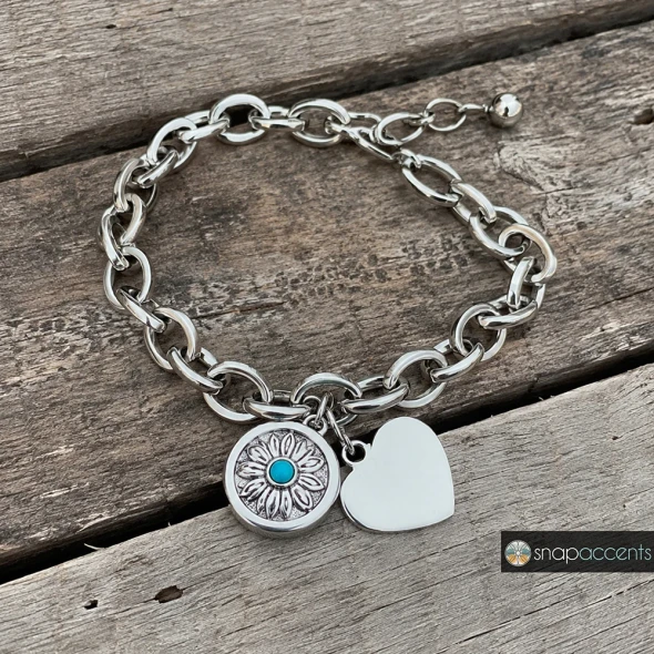 Silver chain link bracelet with interchangeable snap charms, featuring a round donut and heart-shaped charm, stylish customizable jewelry accessory by SnapAccents.