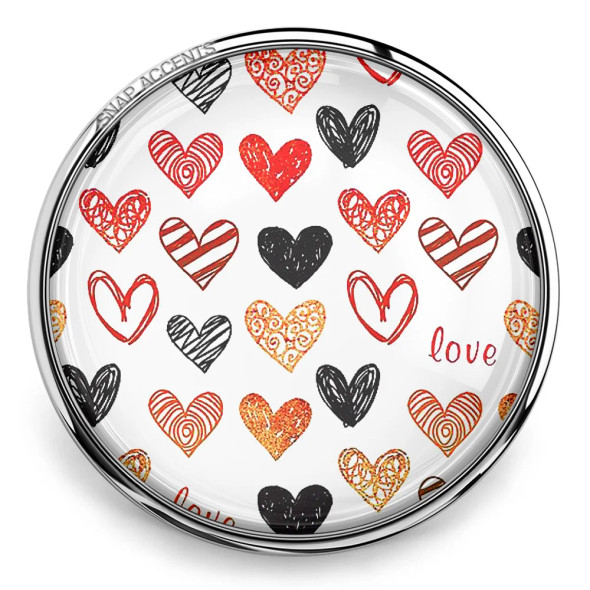 SnapAccents round snap jewelry charm featuring a white background with red, black, and gold hand-drawn heart patterns and the word "love," perfect for Valentine's Day, romantic gifts, or personalized snap jewelry collections.
