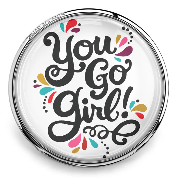 SnapAccents round snap jewelry charm with motivational "You Go Girl!" text in black script, colorful decorative accents, clear glass dome, silver metal base, interchangeable snap button accessory for bracelets and necklaces.