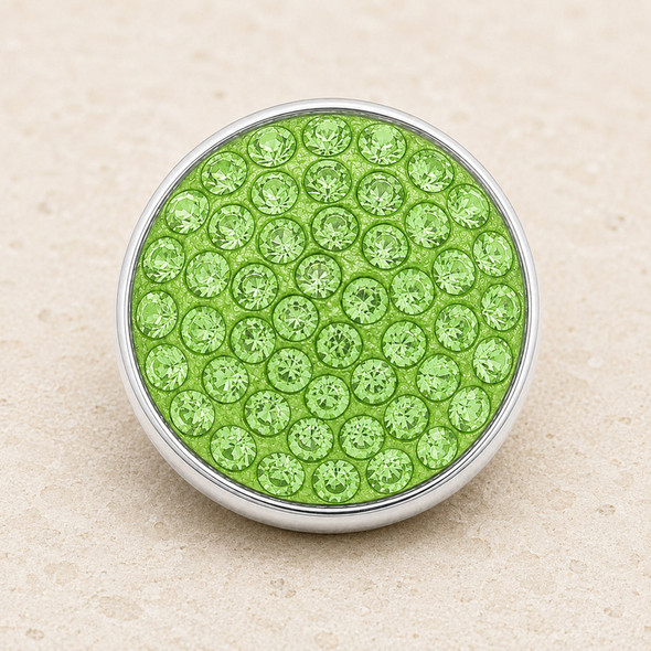 round snap jewelry charm covered with multiple lime green rhinestones set in a silver-tone metal base