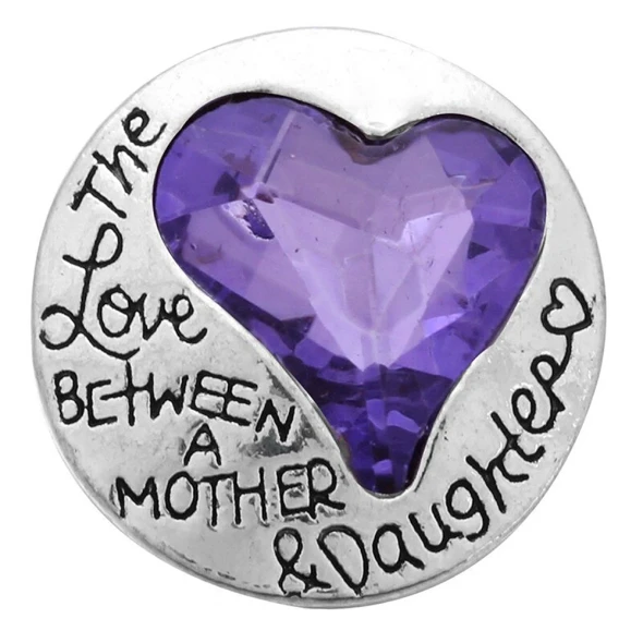 SnapAccents round snap jewelry charm with a purple faceted heart gemstone and engraved message "The Love Between A Mother & Daughter," silver-tone metal, sentimental gift accessory.