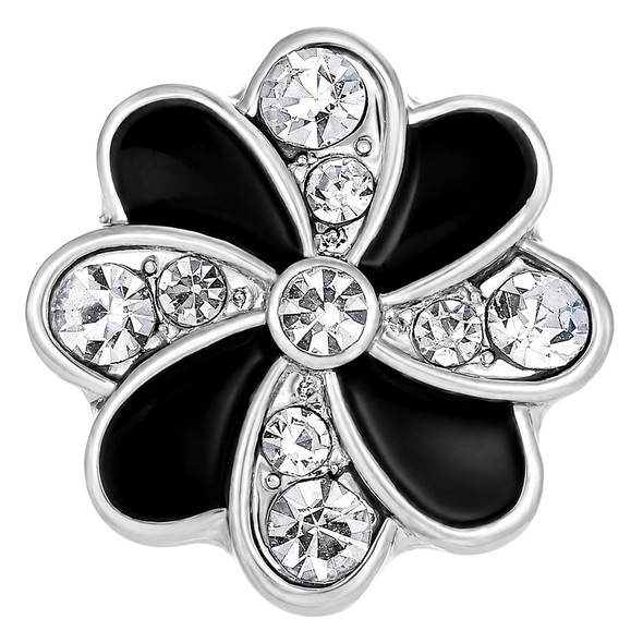 silver-tone snap jewelry charm shaped like a flower with alternating black enamel and clear rhinestone petals
