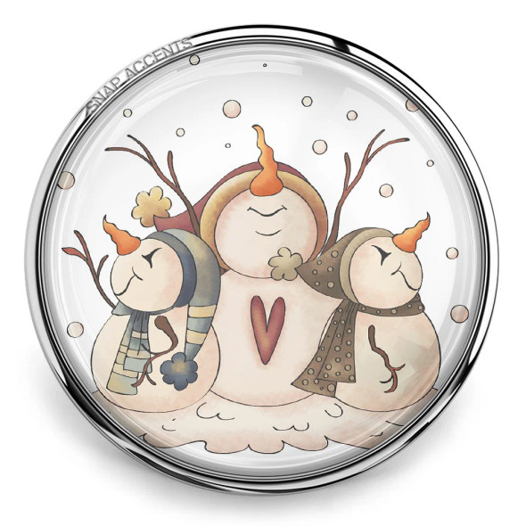 SnapAccents round snap jewelry charm featuring a whimsical trio of snowmen with carrot noses, scarves, and stick arms in a snowy winter scene, perfect for holiday-themed accessories and festive jewelry collections.