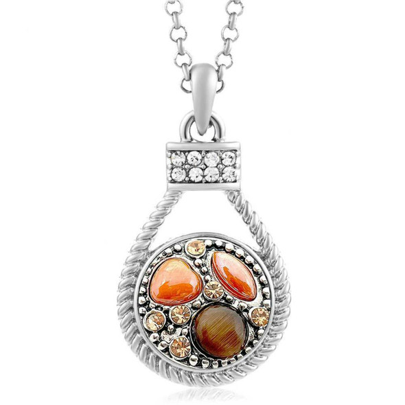 silver-tone snap jewelry necklace with a roped pendant featuring orange and brown snap charms and clear rhinestone accents