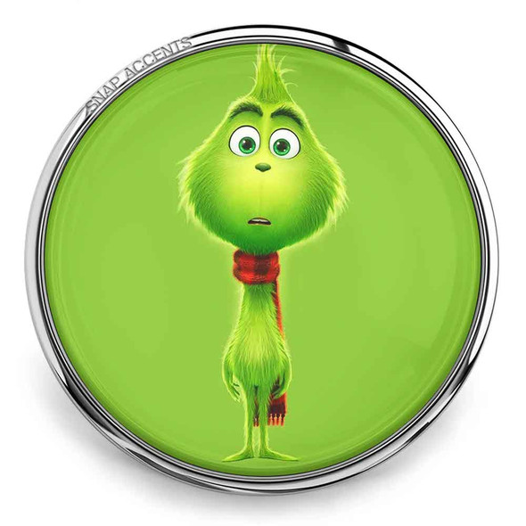 SnapAccents round snap jewelry charm featuring a cute green Grinch character with big eyes and a red scarf on a bright green background, perfect for holiday-themed interchangeable snap bracelets and accessories.