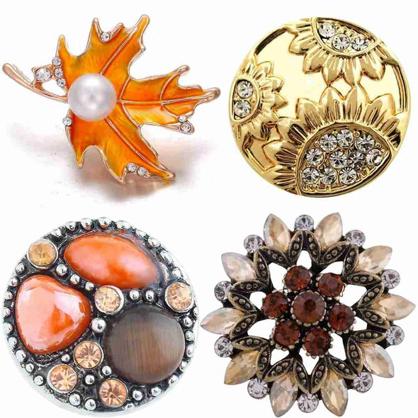 SnapAccents snap jewelry set featuring an orange maple leaf with pearl and crystals, gold-tone floral design with clear rhinestones, round multi-stone snap with orange and brown gems, and vintage-style flower snap with amber and clear crystals, perfect for interchangeable charm bracelets and necklaces.