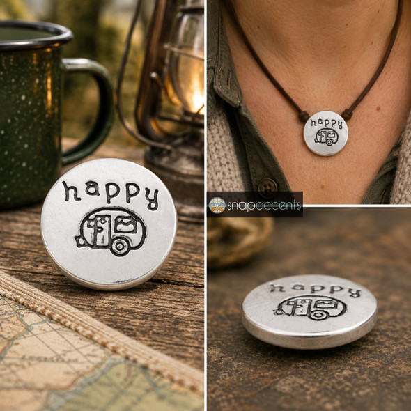 silver-tone snap jewelry charm with hand-stamped camper design and the word happy above it, shown loose and worn on a brown cord necklace