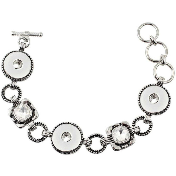 silver-tone snap jewelry bracelet with three snap bases and two antique rhinestone accents linked by textured rings