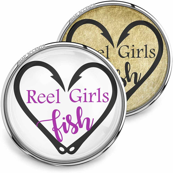 SnapAccents round snap jewelry charm with "Reel Girls fish" text in purple inside a black heart-shaped fishing hook design, available in white and gold backgrounds, perfect for fishing enthusiasts and personalized accessory collections.