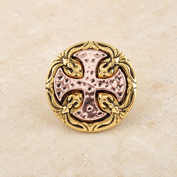 round snap jewelry charm with a textured rose gold cross design set in an ornate gold frame