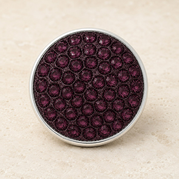 round snap jewelry charm covered in multiple plum purple rhinestones with a silver metal edge