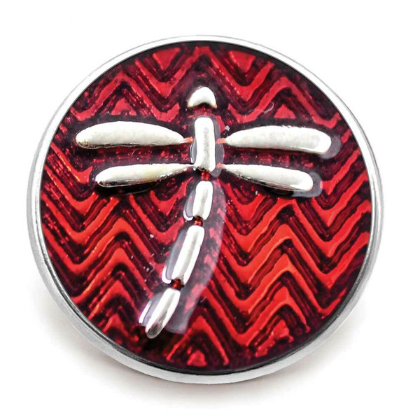 round snap jewelry charm with a silver dragonfly on a red chevron patterned background
