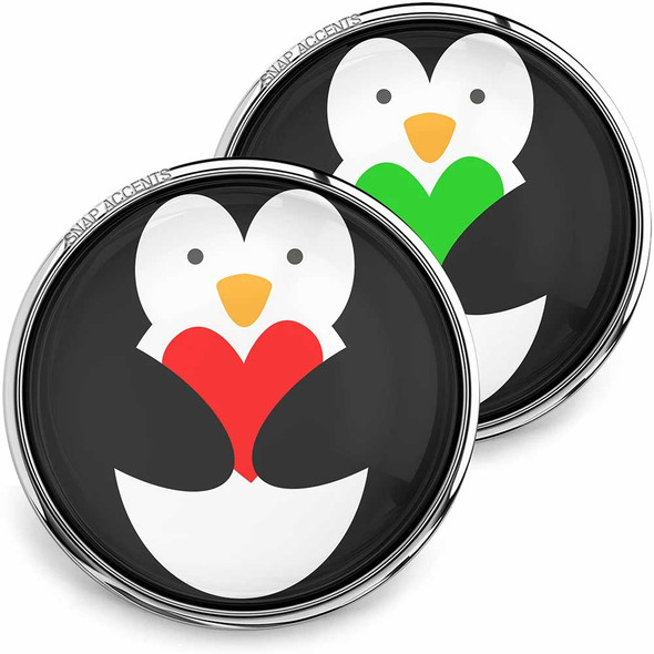 SnapAccents snap jewelry featuring cute penguin design holding red and green heart shapes, interchangeable snap buttons with silver metal rim, perfect for personalized charm bracelets, necklaces, and accessories, winter-themed gift idea, stylish and playful snap jewelry pieces for women and teens.