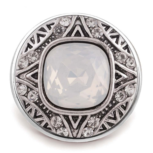 Round SnapAccents snap jewelry charm with a large faceted white opal center stone, surrounded by intricate silver-tone metalwork and clear rhinestone accents, perfect for interchangeable snap button bracelets and accessories.