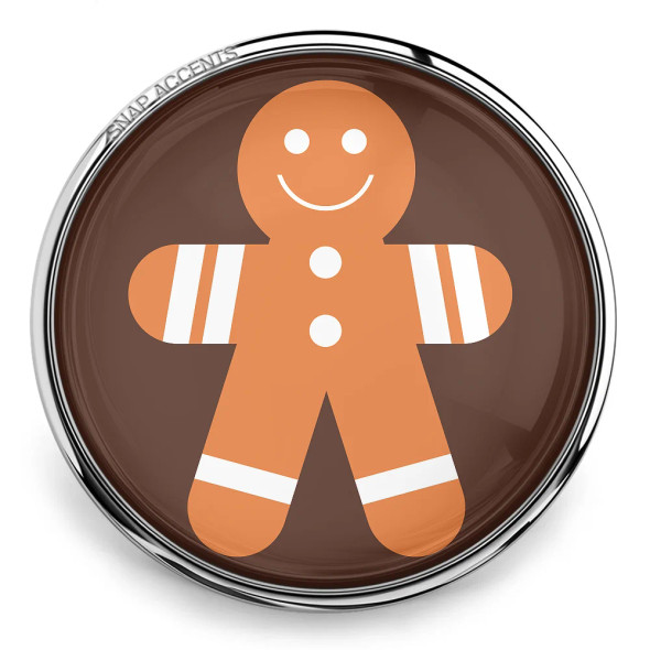 SnapAccents snap jewelry charm featuring a smiling gingerbread man with white icing details on arms and legs, set on a brown background with a silver metal frame, perfect for holiday-themed interchangeable snap jewelry accessories.
