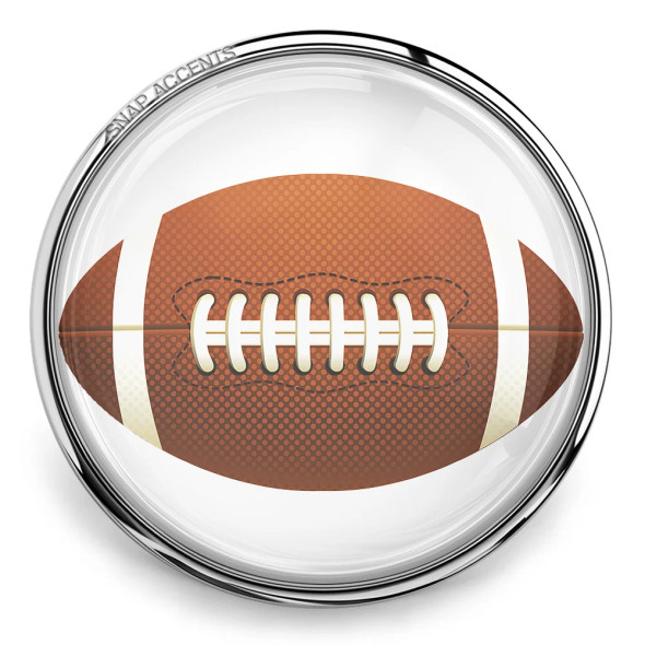 SnapAccents snap jewelry charm featuring a detailed American football design with brown textured surface, white laces, and stripes, set in a shiny silver-tone round frame, perfect for sports fans and customizable snap jewelry collections.
