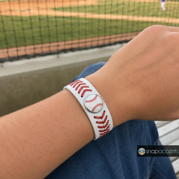 White leather snap bracelet with red baseball stitch design, adjustable snap button closure, sporty baseball-themed jewelry accessory by SnapAccents, perfect for sports fans and casual wear.